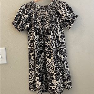 Smocked dress with cream and black flowers. NWOT